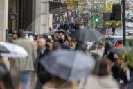 Christmas shoppers search for black friday deals, London, UK.