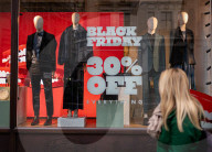 Christmas shoppers search for black friday deals, London, UK.