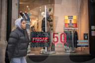 Christmas shoppers search for black friday deals, London, UK.