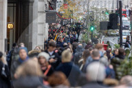 Christmas shoppers search for black friday deals, London, UK.