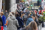 Christmas shoppers search for black friday deals, London, UK.