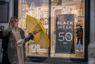 Christmas shoppers search for black friday deals, London, UK.