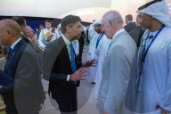 The Prime Minister Rishi Sunak talks to other world leaders at COP28