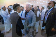 The Prime Minister Rishi Sunak talks to other world leaders at COP28