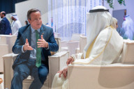 The Foreign Secretary David Cameron talks to other leaders at COP28