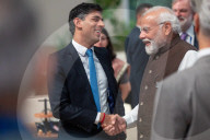 The Prime Minister Rishi Sunak talks to other world leaders at COP28