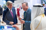 The Foreign Secretary David Cameron talks to other leaders at COP28