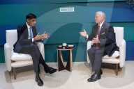 The Prime Minister Rishi Sunak talks to other world leaders at COP28