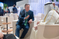 The Foreign Secretary David Cameron talks to other leaders at COP28