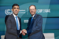 The Prime Minister Rishi Sunak talks to other world leaders at COP28
