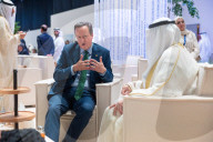 The Foreign Secretary David Cameron talks to other leaders at COP28