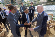 The Prime Minister Rishi Sunak talks to other world leaders at COP28