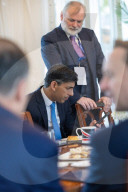 The Prime Minister Rishi Sunak talks to the media ahead of COP28