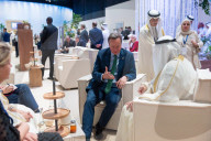 The Foreign Secretary David Cameron talks to other leaders at COP28