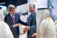 The Foreign Secretary David Cameron talks to other leaders at COP28