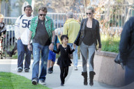 French singer Johnny Hallyday and his wife Laetitia pick up their two adopted daughters from school in Brentwood