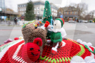 Christmas postbox topper outside Colliers Wood tube station, London, UK. 