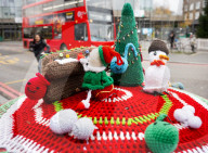Christmas postbox topper outside Colliers Wood tube station, London, UK. 