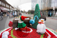 Christmas postbox topper outside Colliers Wood tube station, London, UK. 