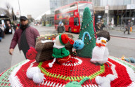 Christmas postbox topper outside Colliers Wood tube station, London, UK. 