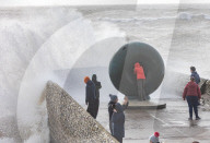 Beach goers in Brighton as Storm Gerrit batters the UK 