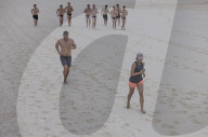 Enter sandman: the cleaner raking 50km of Sydney's famous beaches into morning neatness
