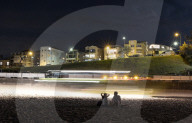 Enter sandman: the cleaner raking 50km of Sydney's famous beaches into morning neatness