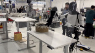 Elon Musk robot shows human like movement in folding a t-shirt