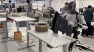 Elon Musk robot shows human like movement in folding a t-shirt