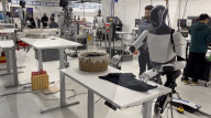 Elon Musk robot shows human like movement in folding a t-shirt