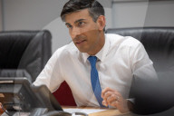 The Prime Minister Rishi Sunak talks to the US President
