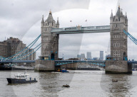 Police recover a body in the River Thames in London, UK.