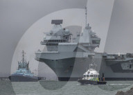 HMS Queen Elizabeth leaves Portsmouth, UK.