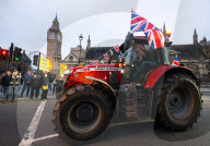 British farmers drove tractors to the Houses of Parliament, Westminster, London, UK.