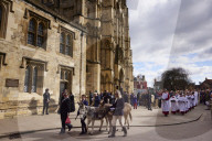 Donkeys lead the clergy and choir in procession into York Minster for the Palm Sunday Eucharist