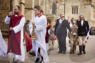 Donkeys lead the clergy and choir in procession into York Minster for the Palm Sunday Eucharist