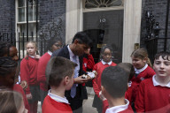 Prime Minister Rishi Sunak greets school children