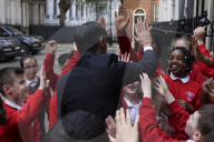 Prime Minister Rishi Sunak greets school children