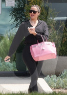 *EXCLUSIVE* Khloe Kardashian Runs into a Friend on Her Way Out of the Office***web must call for pricing***