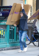*EXCLUSIVE* Film Director Paul Haggis struggles carrying FedEx boxes with his son James during a windy day in NYC