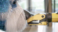 Robot dog Spot sparkles in  a canine suit
