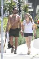 *EXCLUSIVE* Becki Newton and Chris Diamantopoulos Enjoy a Sunny Stroll with Their Furry Friend