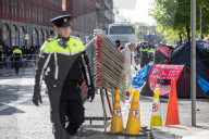 Dublin sends in police and buses to dismantle tent city