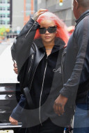 *EXCLUSIVE* Rihanna pops out in vibrant pink hair as she leaves New York to attend the F1 race in Miami this weekend **WEB MUST CALL FOR PRICING**