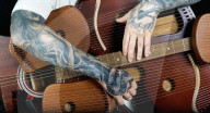 Musician creates 109 string guitar harp hybrid