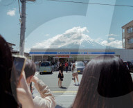 Japan, over tourism at convenience store with Mount Fuji