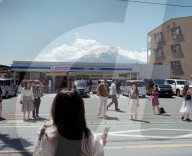 Japan, over tourism at convenience store with Mount Fuji