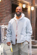 *EXCLUSIVE* Common is all smiles on a film set in NYC