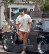 EXCLUSIVE: From Gentleman to Bin Man! British Actor And James Bond Front Runner Theo James Lugs Out Some Rubbish Before Taking a Spin in His Newly Delivered Rare $220K Vintage Buick Sports Car - 14 May 2024