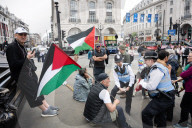 Enough Is Enough Pro Israeli counter protest facing a pro Palestine march through central London, UK.